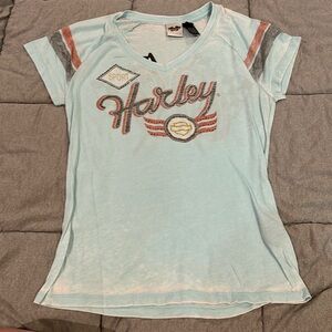 Harley Davidson. Short sleeve shirt with orange and black bling.